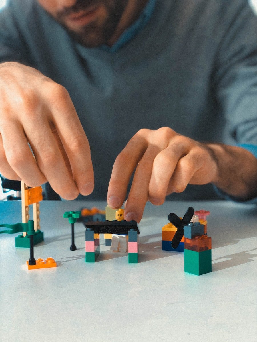 a man building a building blocks