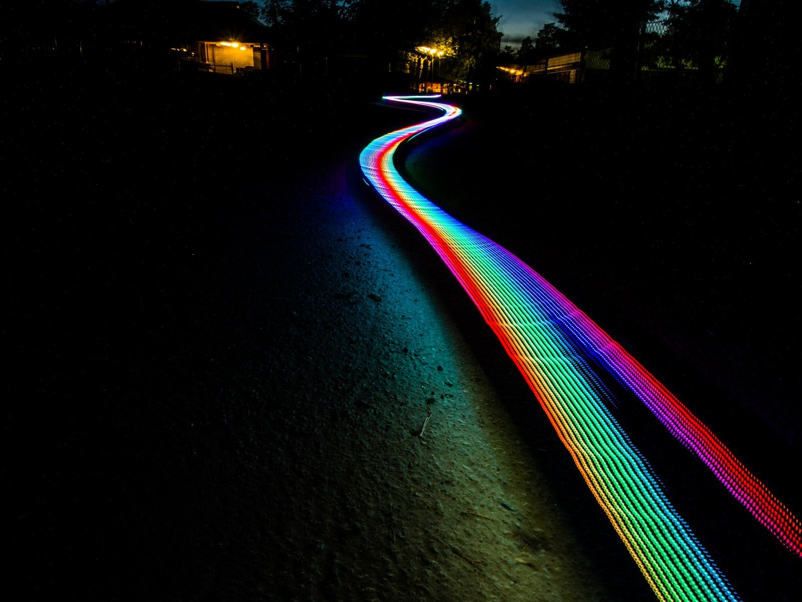 multicolored light passage in dark area