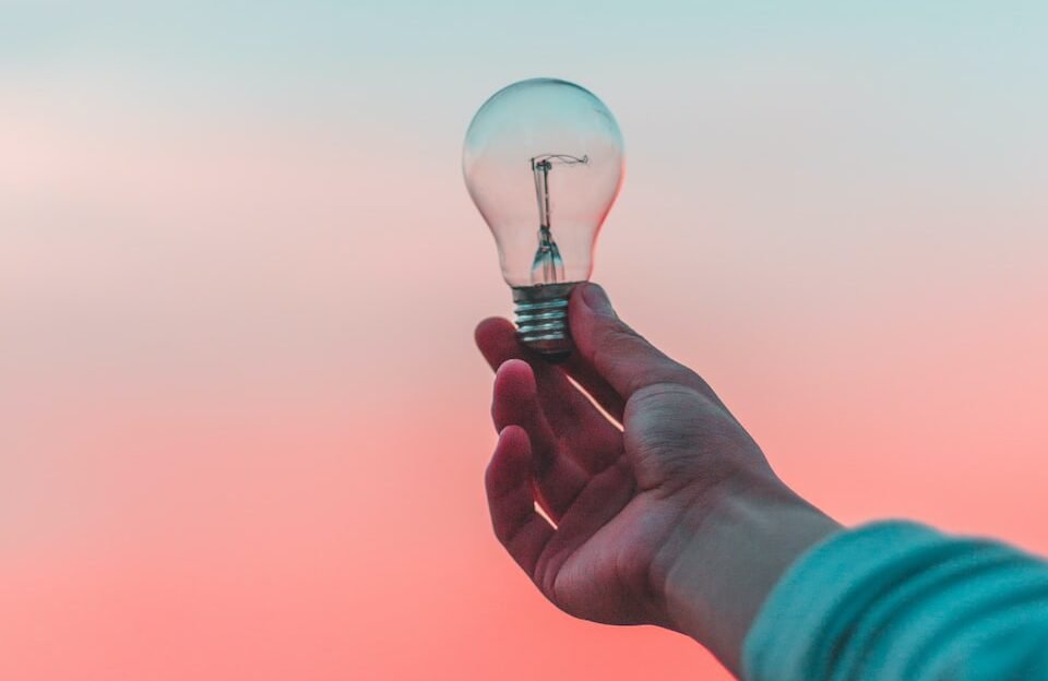 person holding light bulb