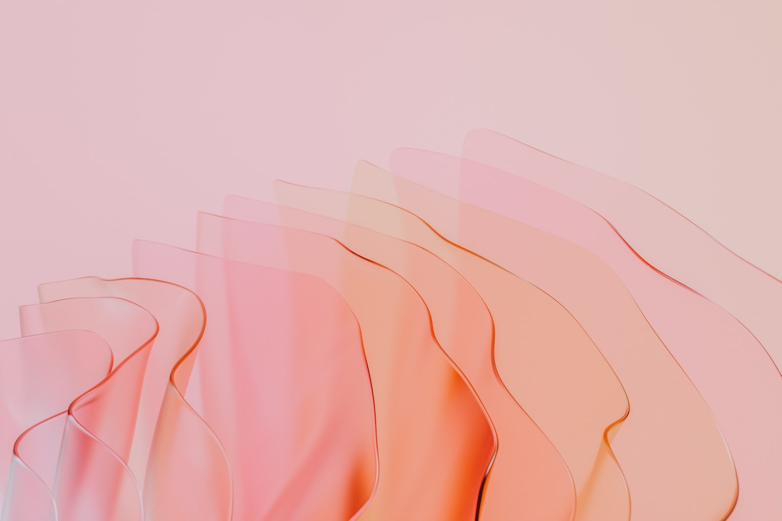 a pink and orange background with wavy lines