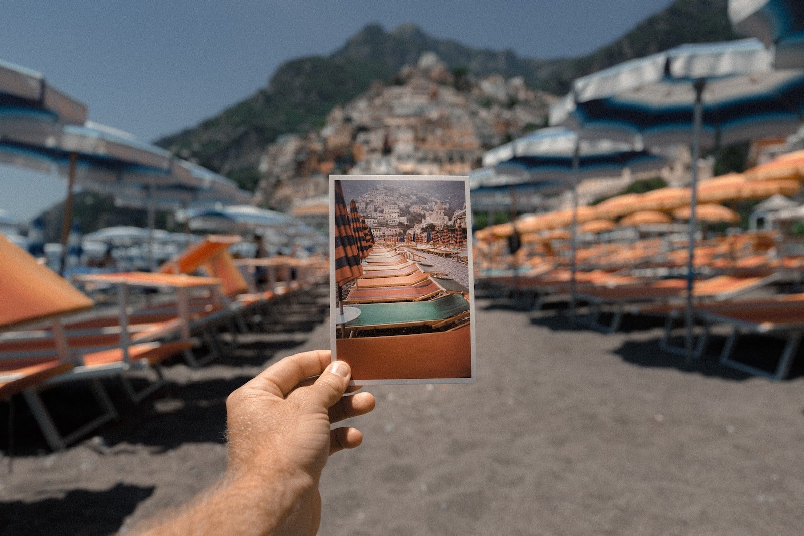 person holding outdoor lounge chairs photo