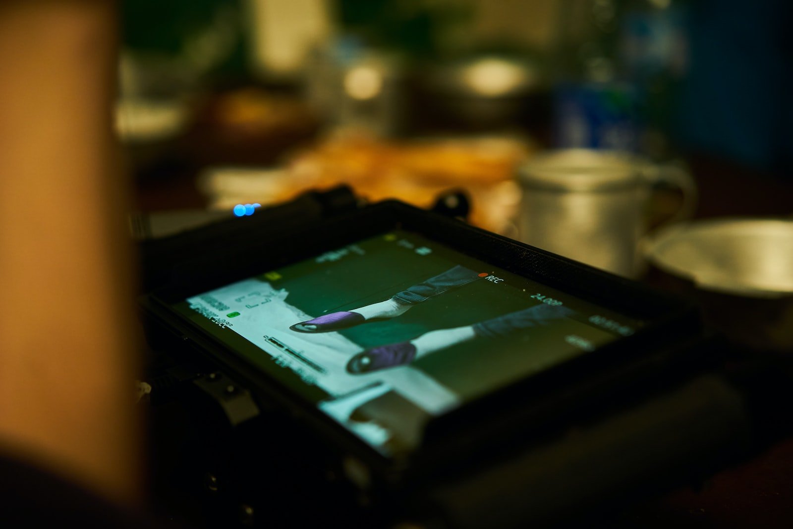 black tablet computer turned on in tilt shift lens